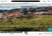 Restos de obra são descartados entre pedras na praia de Jauá